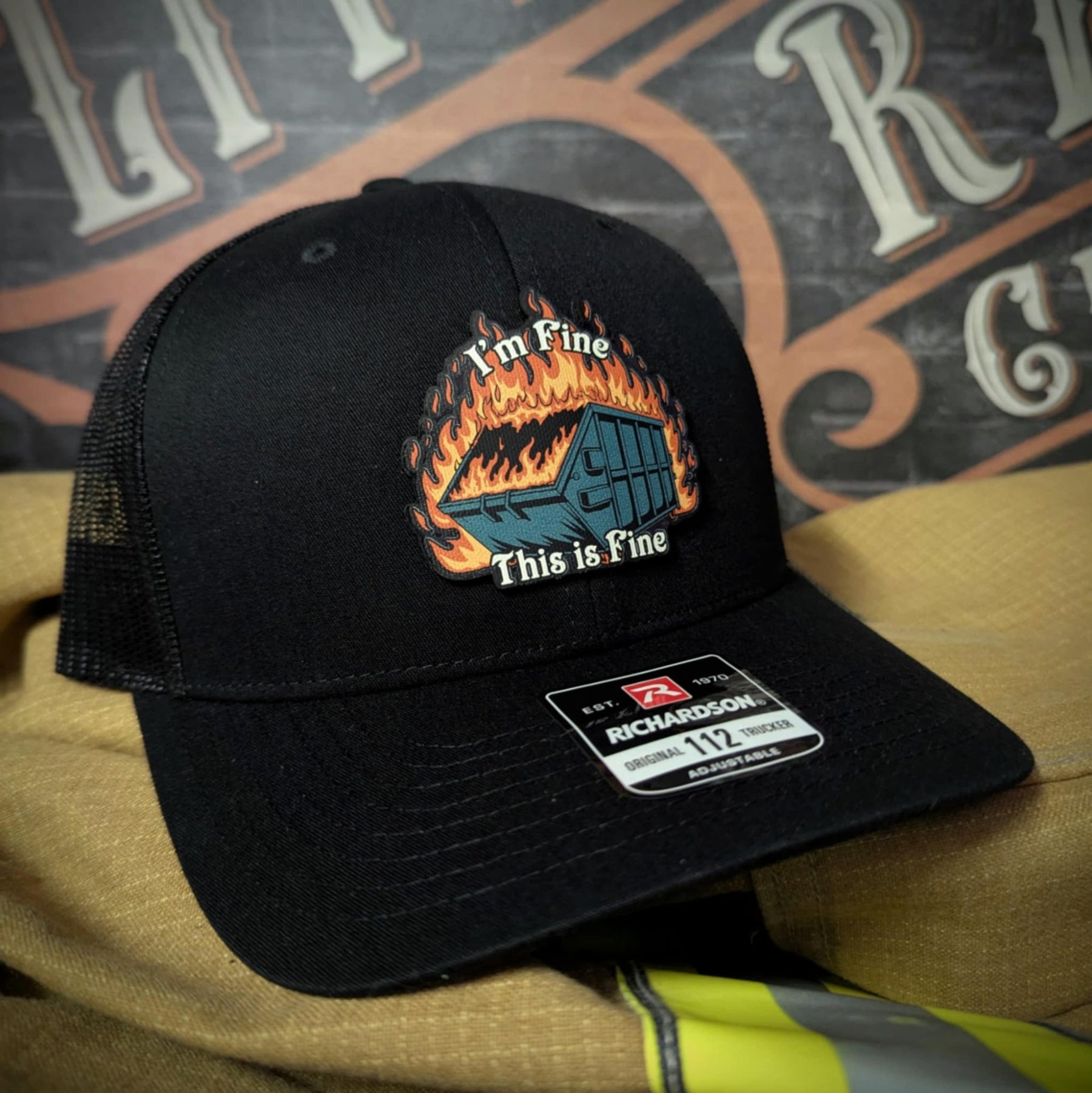Funny Richardson hat with leather patch of dumpster fire and the quote 'I’m fine, this is fine'.