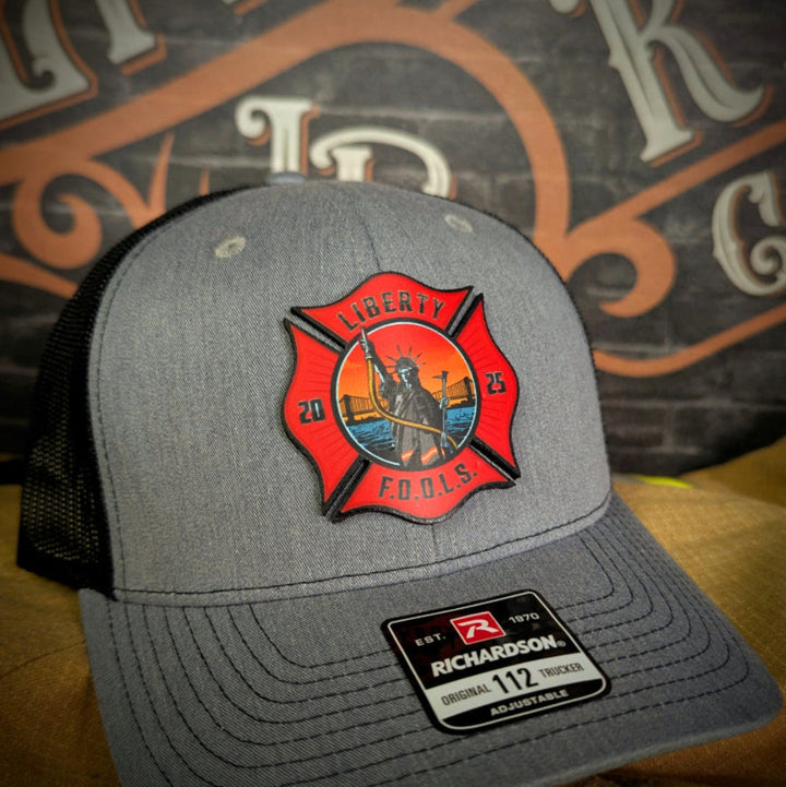 Liberty City FOOLS firefighter hat with custom logo – featuring bold Liberty FOOLS designs for fire crews.