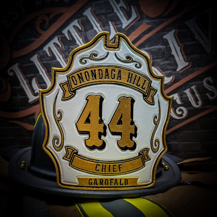 Hand painted custom leather firefighter helmet shield. 