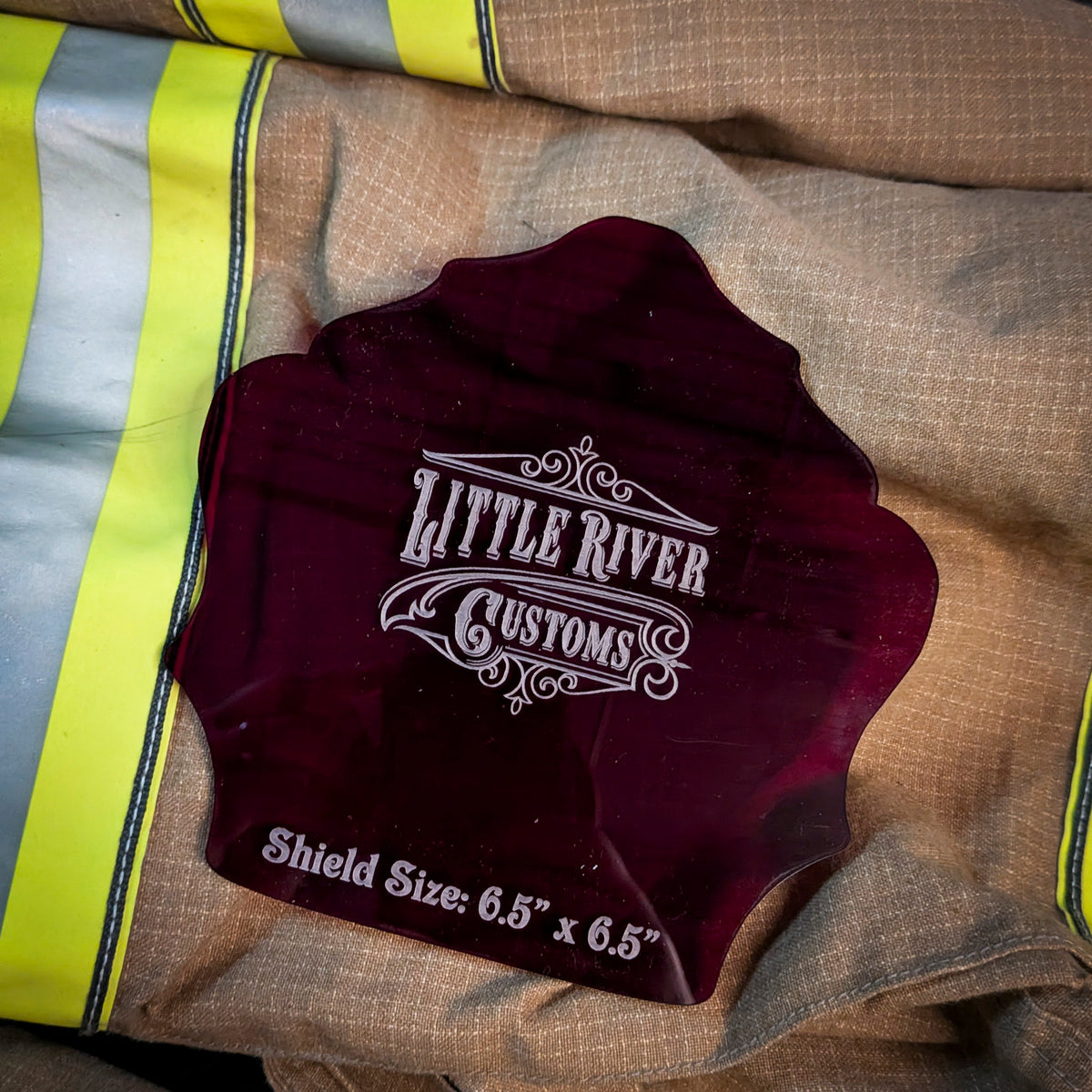 Red acrylic firefighter helmet shield template with scalloped edges and size marking