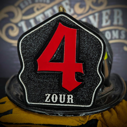 Black leather firefighter helmet shield with oversized red numeral “4” and white name lettering—mounted on a helmet.