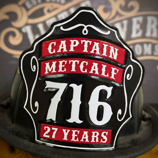 Custom leather firefighter helmet shield for Captain Metcalf, number 716, honoring 27 years of service in black, red, and white design.