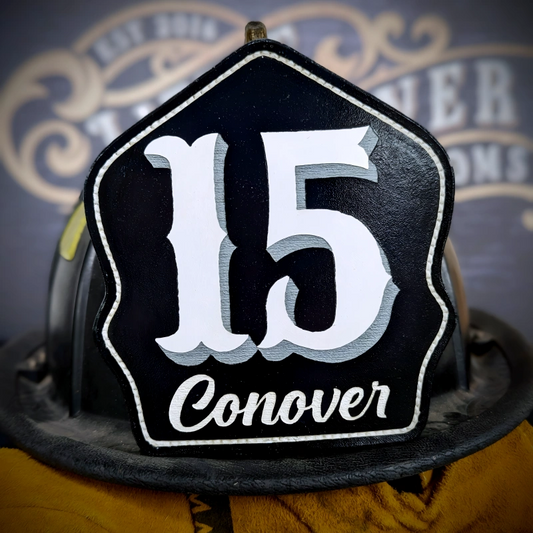Classic leather firefighter helmet shield custom front with number 15 and Conover lettering, handcrafted for traditional fire helmets