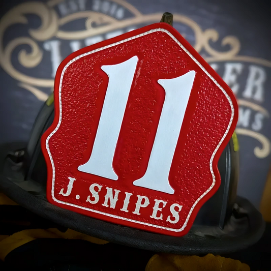 Custom leather firefighter helmet shield in company style built for station identity