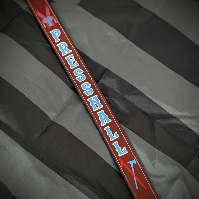 Custom leather firefighter radio strap with bright blue text