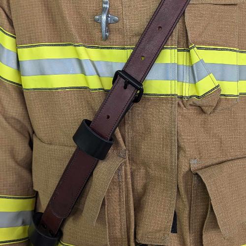 Firefighter radio strap showing durable leather texture