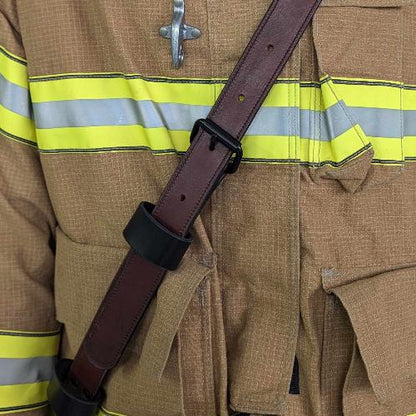 Firefighter radio strap showing durable leather texture