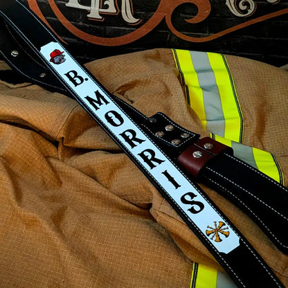 Firefighter radio strap hanging from gear locker for storage