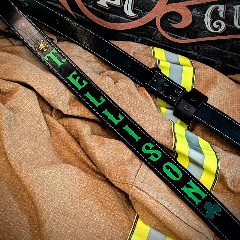 Leather firefighter radio strap displayed with radio equipment