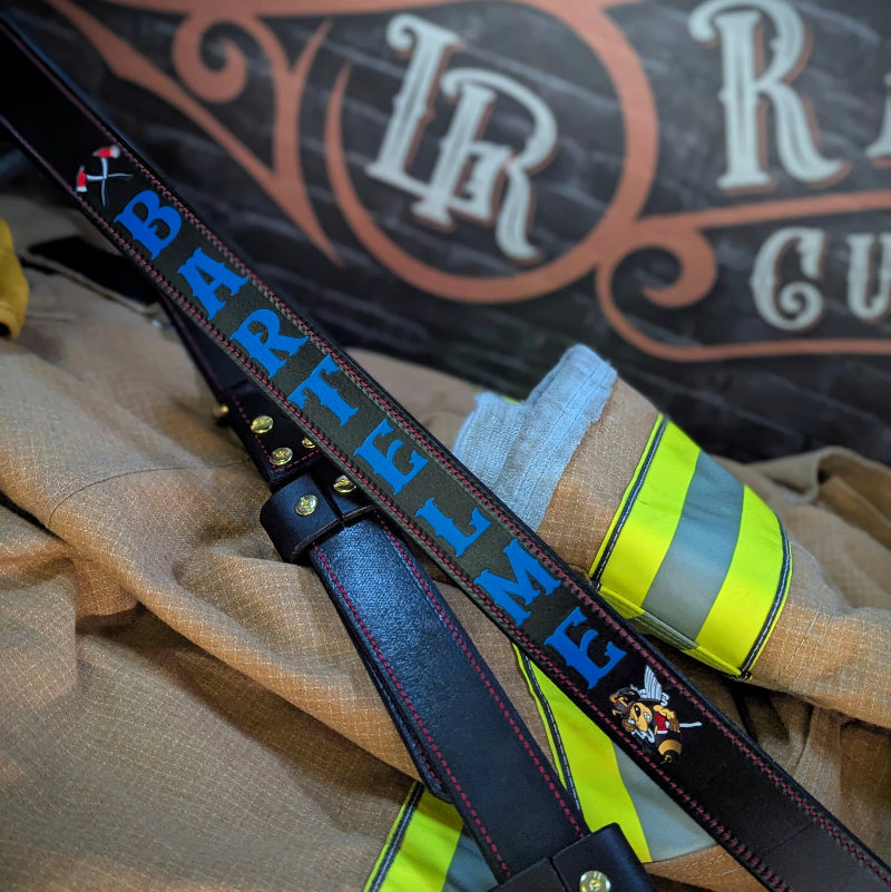 Detailed view of firefighter radio strap hardware and stitching