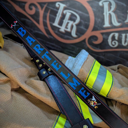 Detailed view of firefighter radio strap hardware and stitching