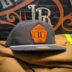 Firefighter hat featuring traditional leather shield patch design