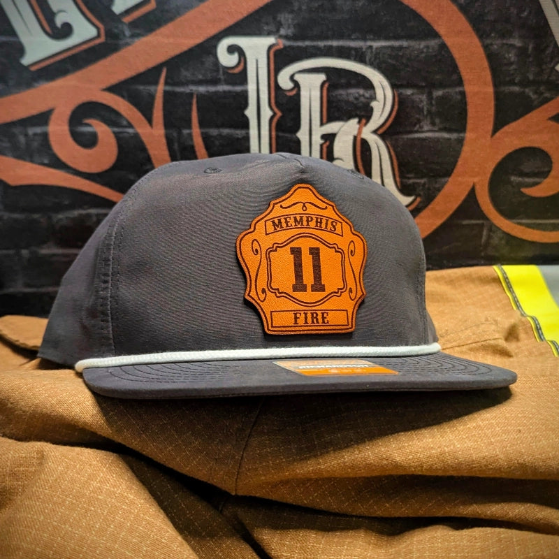 Firefighter hat featuring traditional leather shield patch design