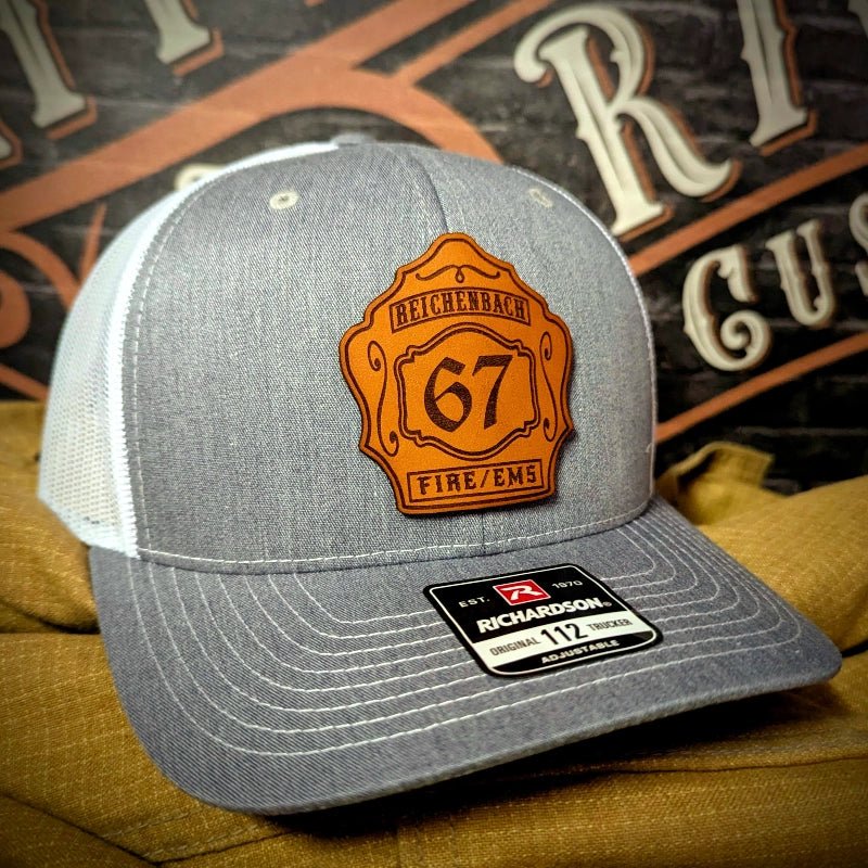 Station hat with customizable leather firefighter shield patch