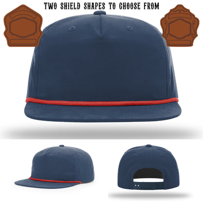 Fire department hat with two leather shield patch designs