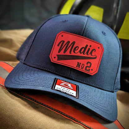 Custom EMS leather patch hat showing sharp clear lettering detail