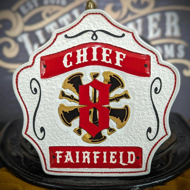 custom leather helmet shield designed for fire service tradition
