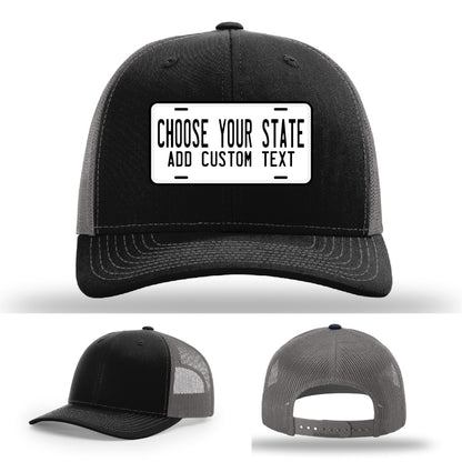 Rugged leather patch hat styled after state plate with custom slogan option