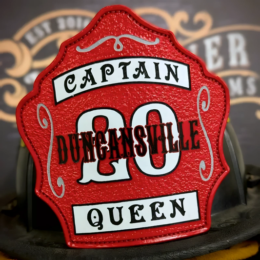 Custom leather firefighter helmet shield with bold red Duncansville Captain 20 design, durable fire department gear.