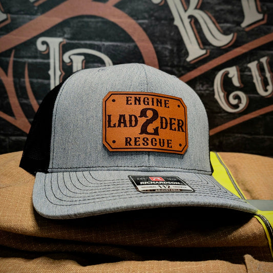 Gray and black Richardson hat with custom leather patch for Engine Ladder 2 Rescue