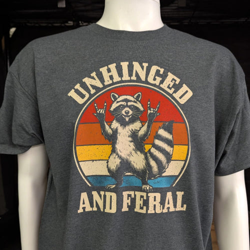 Feral Vibes Graphic Tee with rock on raccoon design retro sunset background and bold unisex style