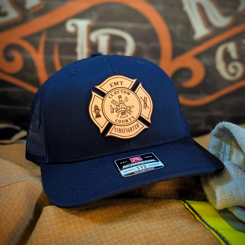 Custom firefighter hat with Maltese Cross artwork