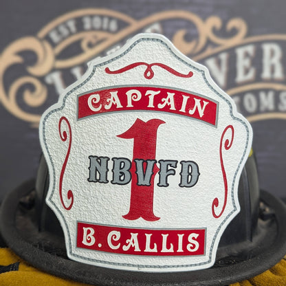 White leather firefighter helmet shield with bold red number 1 and captain lettering, custom fire department gear.