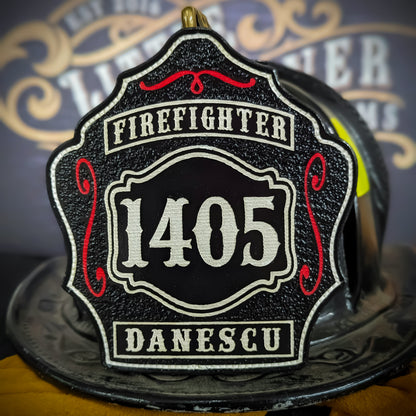Black leather firefighter helmet shield with bold white number 1405, white text panels reading Firefighter and Danescu, red scroll accents, mounted on a fire helmet.