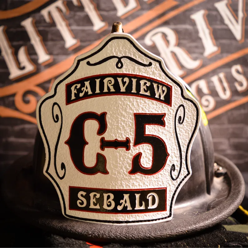 Standard Issue custom firefighter helmet shield with C-5 designation, Fairview lettering, and Sebald name in white leather with black and red detailing.