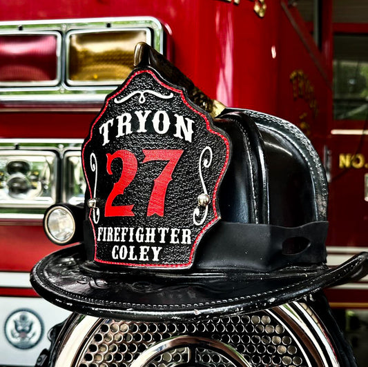Custom leather firefighter helmet shield Tryon 27 with red numbers and traditional black leather fire helmet design.