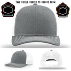 Fire department hat displayed with two shield patch examples