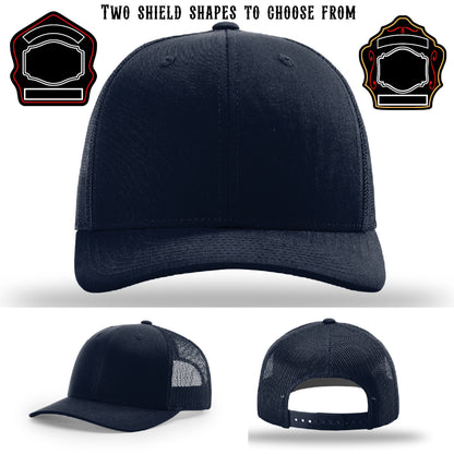 Firefighter hat displayed with two shield patch shapes