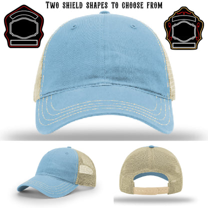 Station hat displayed with two shield patch shapes in color