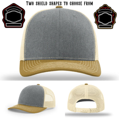 Station hat displayed with two firefighter shield patch samples