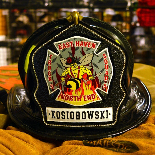 Full custom fire helmet shield featuring department name and rank.