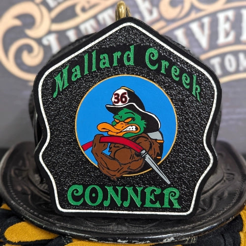 Personalized leather helmet shield designed with custom colors and layout.