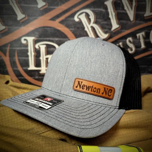 Low Ride leather patch hat with bold custom design and rugged detail