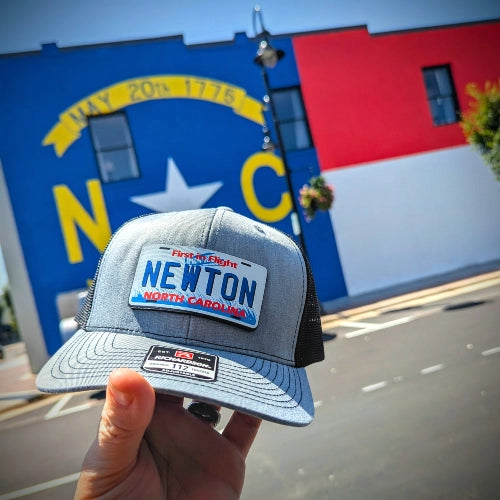 Little River Customs Richardson lifestyle hat photographed in front of Newton NC mural