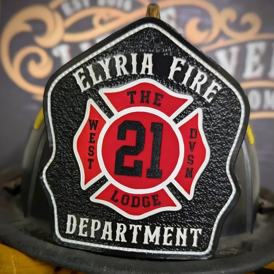 Handcrafted leather firefighter helmet shield featuring bold Maltese cross fire service design