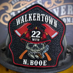 Ole Salty custom firefighter helmet shield with skull and axes design