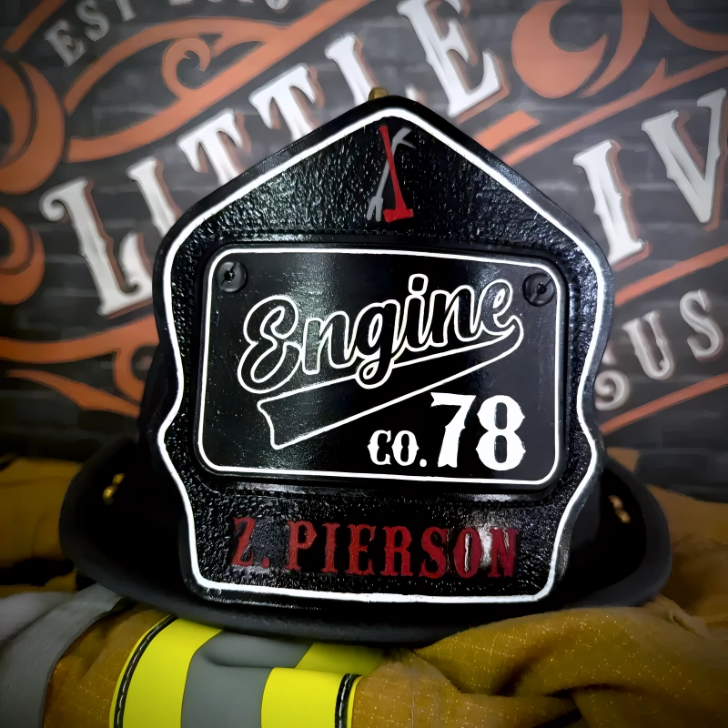 Handcrafted leather firefighter helmet shield in passport style with clean firehouse layout