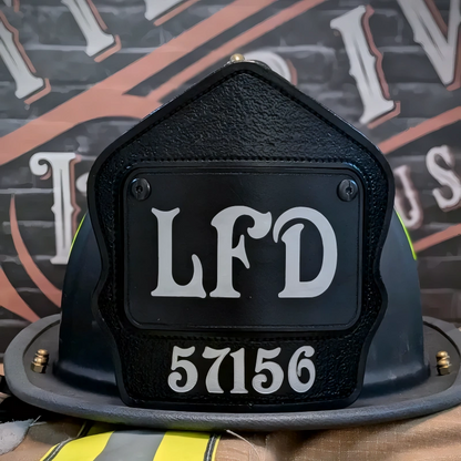 Hand-tooled passport firefighter helmet shield showing clean lettering in leather