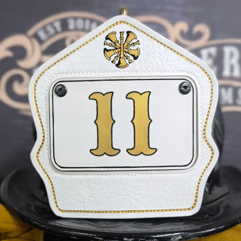Custom leather firefighter helmet shield showing passport design for professional fire service look