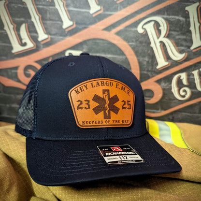 Station apparel hat showing firefighter passport patch with crisp lettering