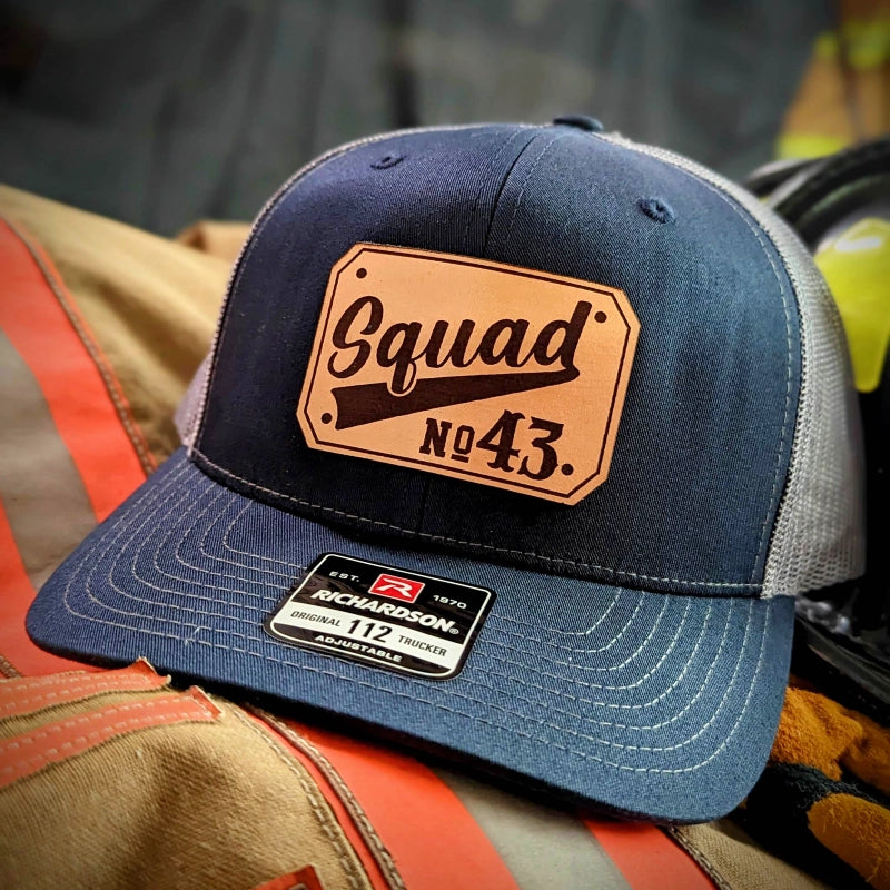 Rugged fire service hat with sharp passport style leather patch on front