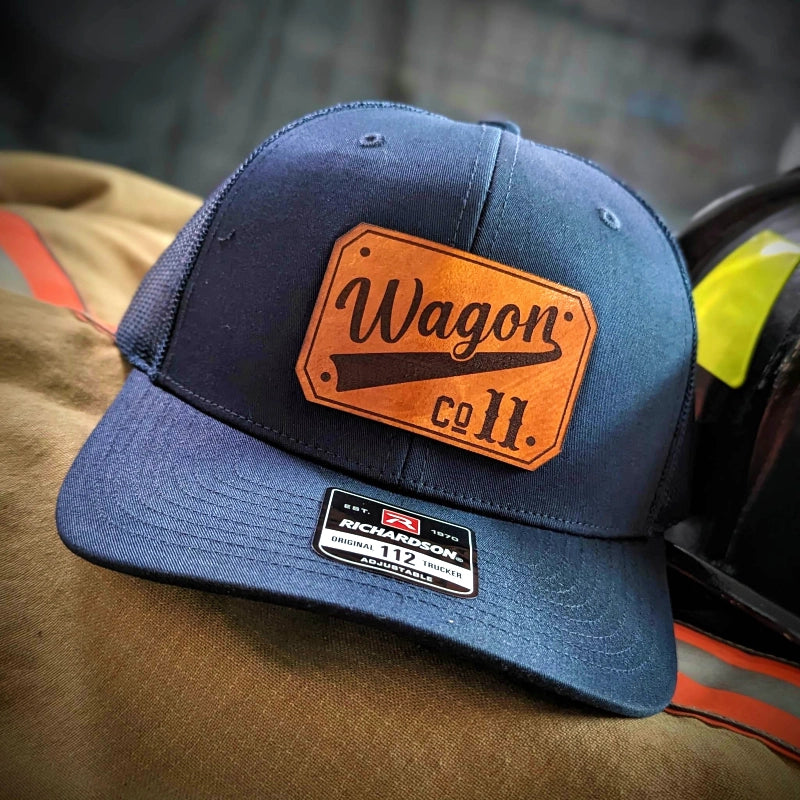 Rugged firefighter hat displaying bold passport leather patch on crown