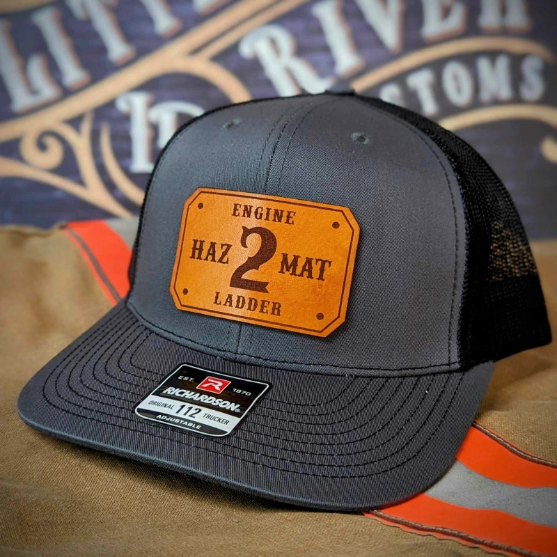Firefighter pride hat with clean passport style leather patch layout
