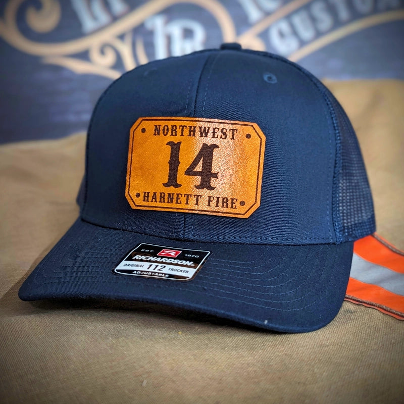 Rugged firefighter hat crafted with passport style leather patch layout