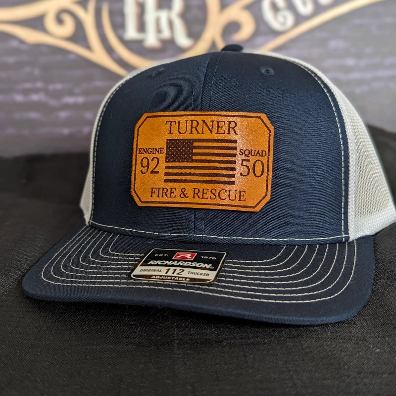 Rugged firehouse hat showing passport patch with firefighter name