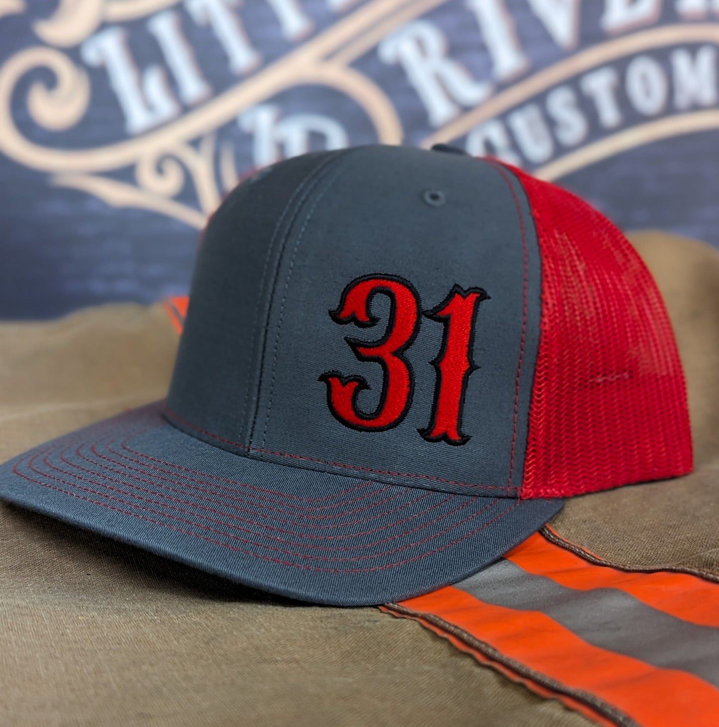 Custom embroidered firefighter hat with bold stitching, structured fit, and premium Richardson snapback design